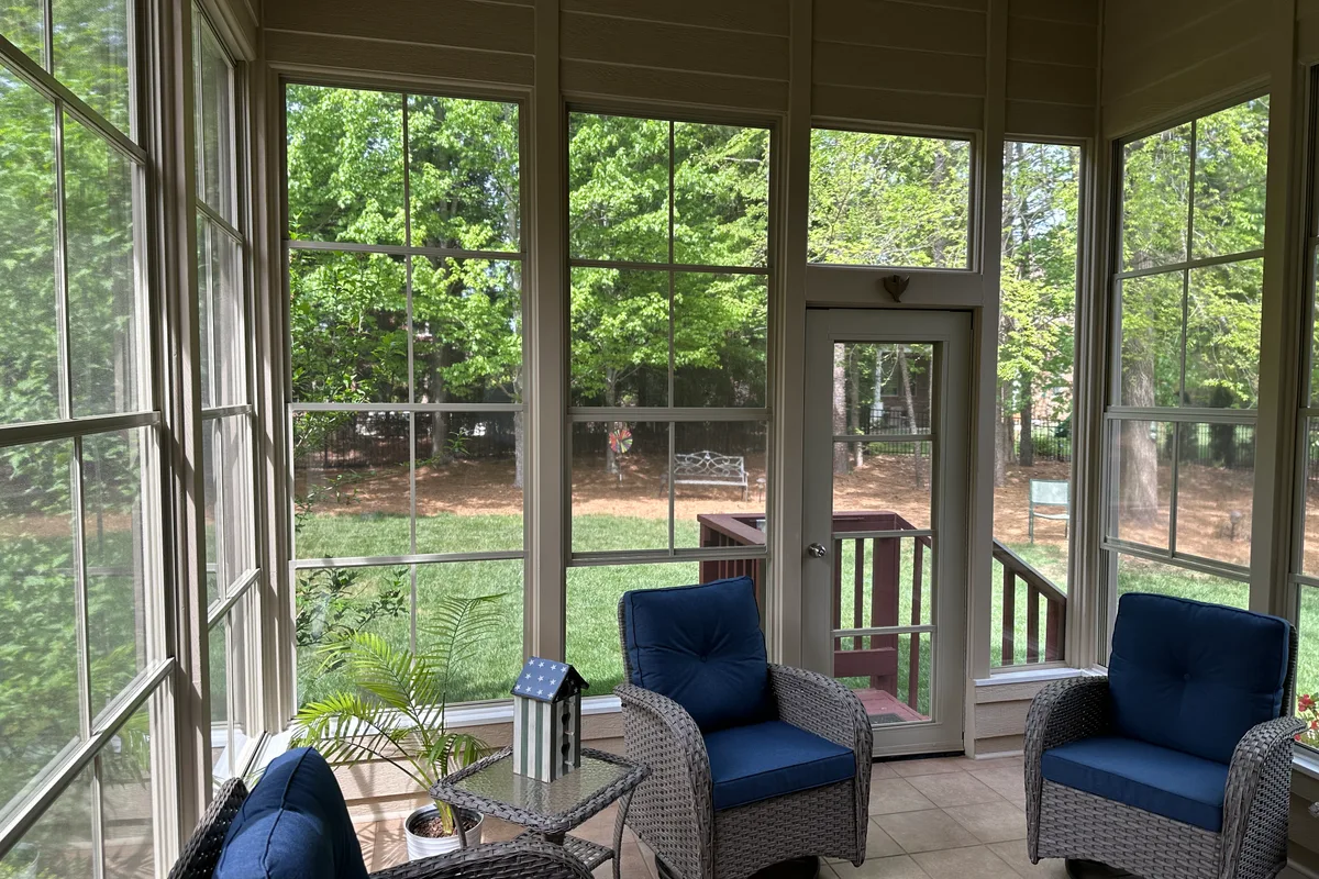 Covered porch vinyl film enclosure detail Matthews NC