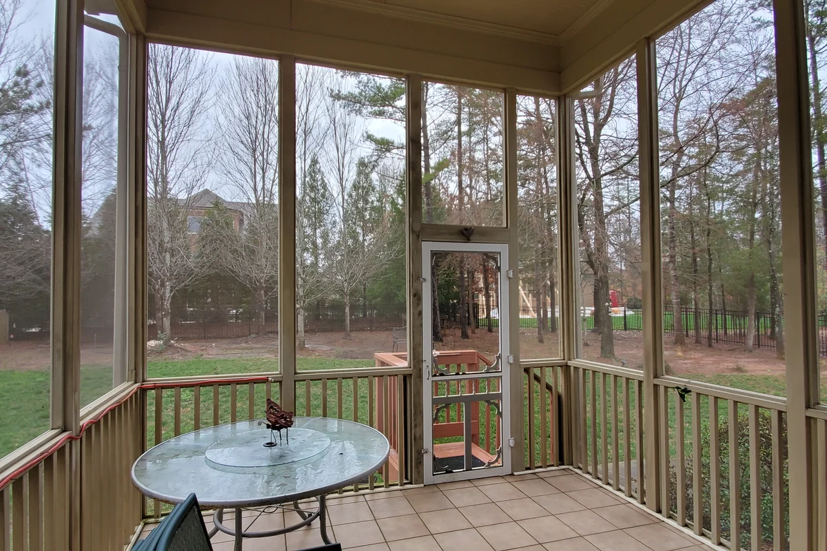 Completed 3-season vinyl film porch enclosure exterior in Camrose, Matthews NC