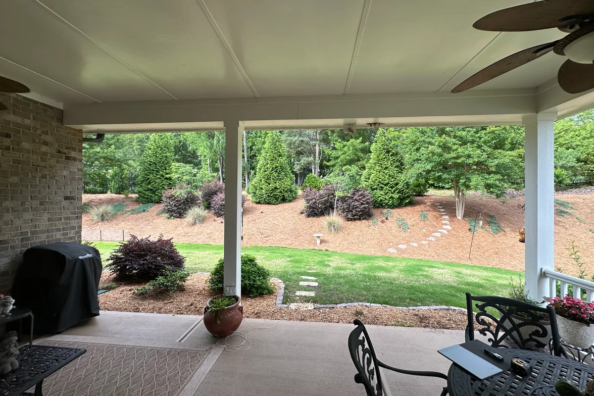 Exposed patio structure prior to vinyl film enclosure Matthews