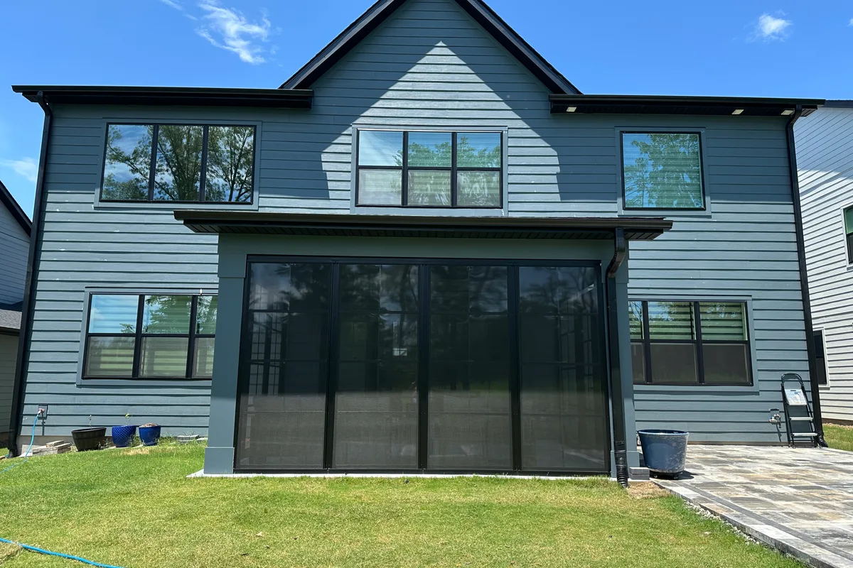 Close-up of vinyl film porch enclosure framing in Tega Cay NC